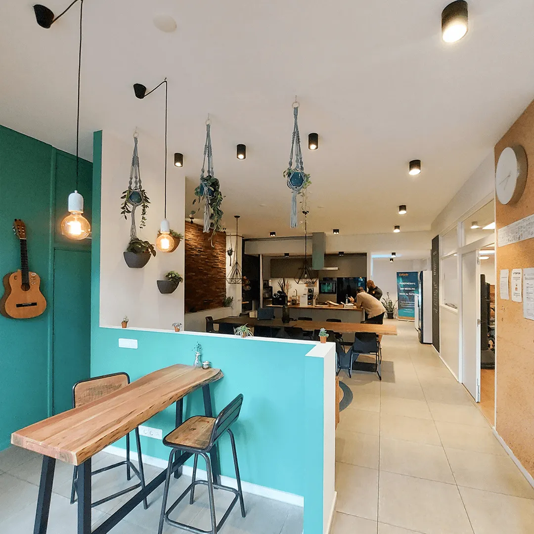 The studio entrance with bar table and view towards the kitchen